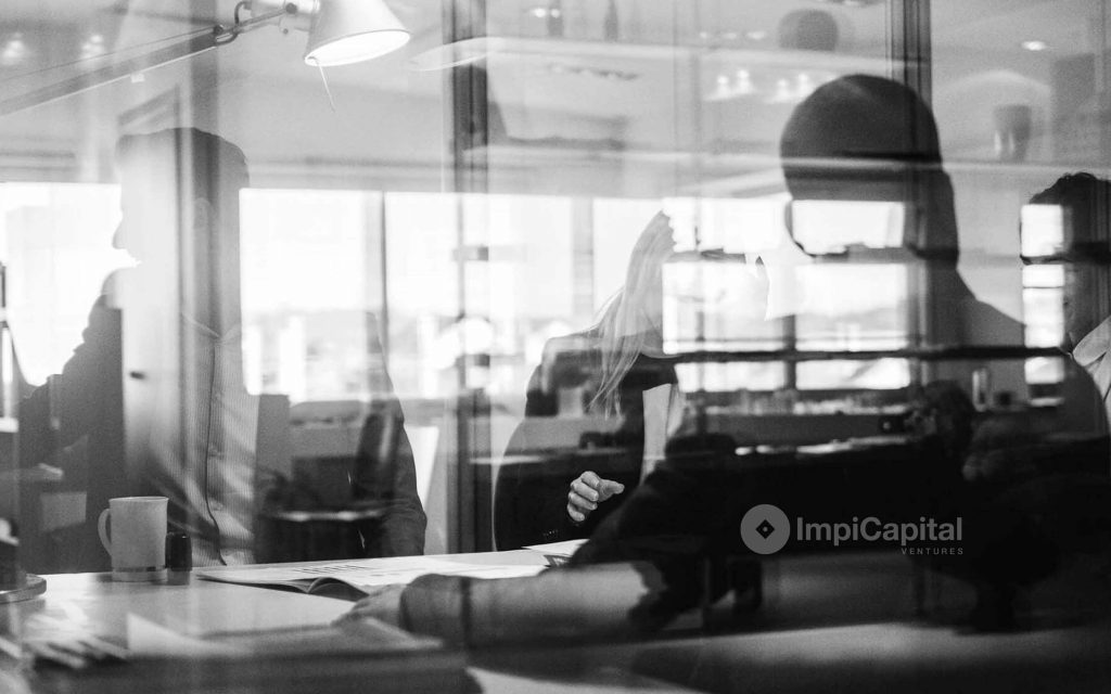 wolf hat studio case study ImpiCapital abstract office workers meeting